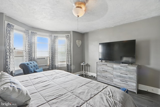 2530 Arunah Ave, Baltimore, MD 21216 - bedroom with baseboards, a textured ceiling, wood finished floors, ceiling fan, and cooling unit