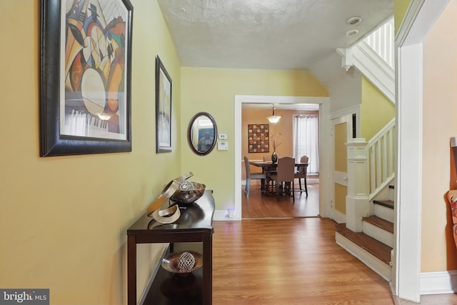 2530 Arunah Ave, Baltimore, MD 21216 - hall with wood finished floors, stairs, and baseboards