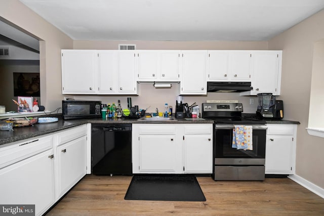 1210 Chelmsford Cir Unit 1210, Newark, DE 19713 - kitchen featuring black appliances, range hood, a sink, dark countertops, and white cabinetry