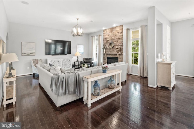 6808 Rehnquist Ct, New Market, MD 21774 - living area with wood-type flooring, a chandelier, a fireplace, and baseboards
