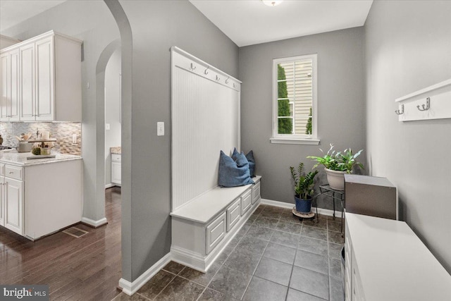 6808 Rehnquist Ct, New Market, MD 21774 - mudroom featuring arched walkways and baseboards