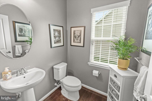 6808 Rehnquist Ct, New Market, MD 21774 - half bath with toilet, baseboards, wood finished floors, and a sink