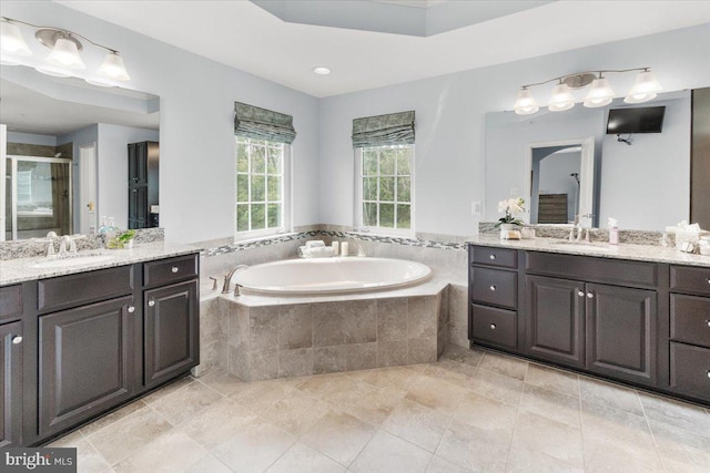 6808 Rehnquist Ct, New Market, MD 21774 - full bathroom with two vanities, a garden tub, and a stall shower