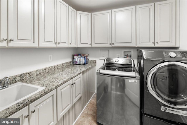 6808 Rehnquist Ct, New Market, MD 21774 - laundry area featuring separate washer and dryer and cabinet space
