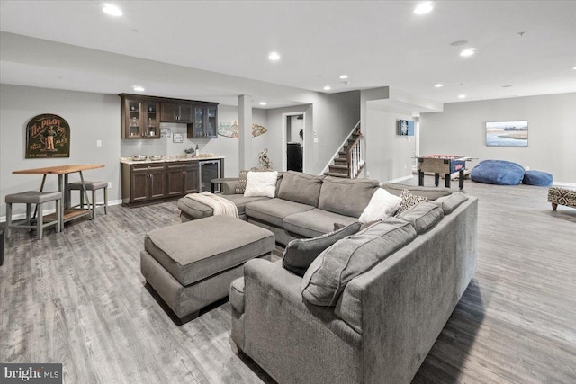 6808 Rehnquist Ct, New Market, MD 21774 - living area featuring wet bar, beverage cooler, light wood-style floors, recessed lighting, and stairs