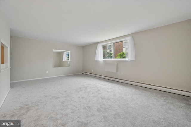8115 W Chester Pike # B-2, Upper Darby, PA 19082 - carpeted empty room with a baseboard heating unit and baseboards