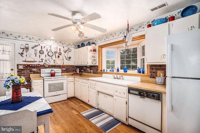 787 Park Rd, Lansdale, PA 19446 - kitchen with white appliances, light countertops, light wood-style floors, ceiling fan, and open shelves