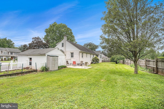 787 Park Rd, Lansdale, PA 19446 - rear view of house with a patio area, a fenced backyard, an outdoor structure, and a chimney