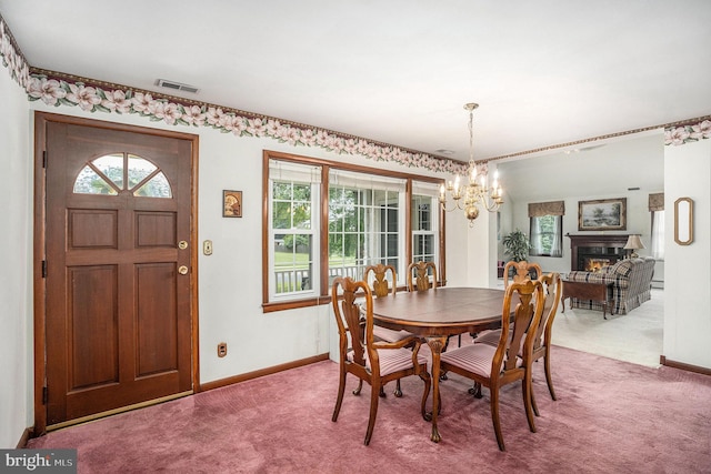 787 Park Rd, Lansdale, PA 19446 - carpeted dining space featuring a chandelier and a lit fireplace