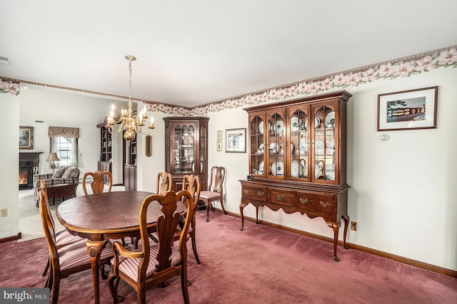 787 Park Rd, Lansdale, PA 19446 - dining area featuring carpet, a chandelier, and a warm lit fireplace