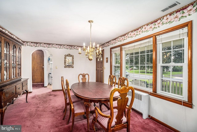 787 Park Rd, Lansdale, PA 19446 - carpeted dining room with arched walkways, a chandelier, and radiator