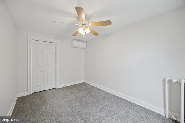 534 Spring Mill Ave, Conshohocken, PA 19428 - unfurnished bedroom featuring radiator heating unit, an AC wall unit, carpet, and baseboards