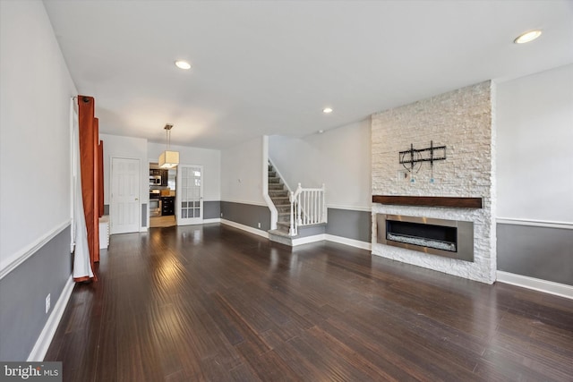 534 Spring Mill Ave, Conshohocken, PA 19428 - unfurnished living room featuring a stone fireplace, baseboards, wood finished floors, and recessed lighting