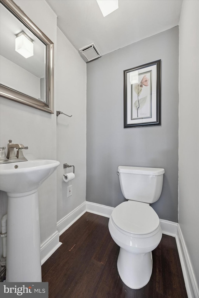 534 Spring Mill Ave, Conshohocken, PA 19428 - bathroom featuring wood finished floors, toilet, and baseboards