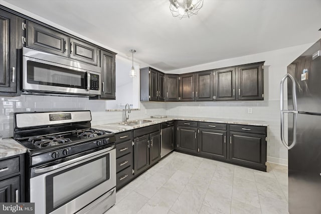 534 Spring Mill Ave, Conshohocken, PA 19428 - kitchen featuring stainless steel appliances, a sink, light stone counters, and tasteful backsplash