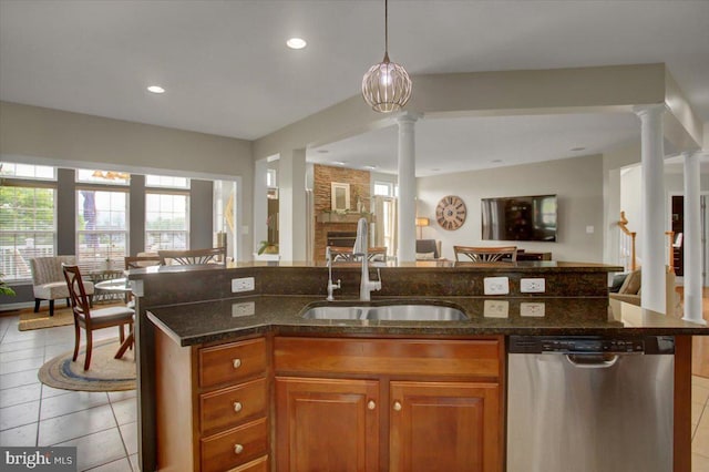 11516 Mystic Rock Ln N, Waynesboro, PA 17268 - kitchen with dishwasher, decorative columns, a sink, open floor plan, and brown cabinets