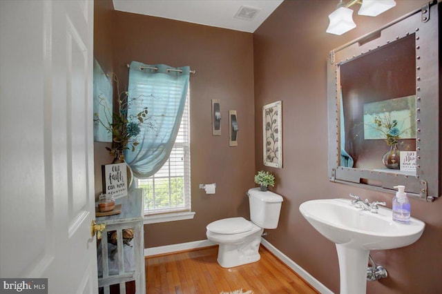11516 Mystic Rock Ln N, Waynesboro, PA 17268 - half bathroom featuring toilet, wood finished floors, and baseboards