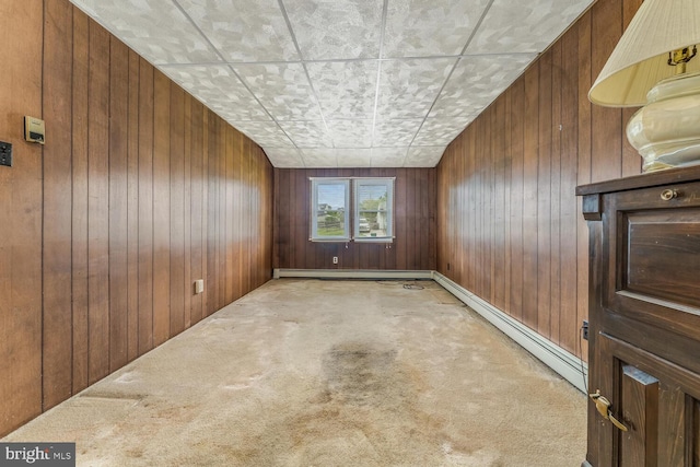 54 Cobalt Ridge Dr E, Levittown, PA 19057 - empty room featuring wood walls, carpet, and a baseboard radiator