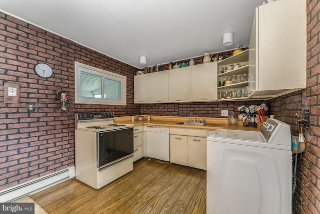 54 Cobalt Ridge Dr E, Levittown, PA 19057 - kitchen featuring electric stove, dishwasher, brick wall, a baseboard heating unit, and a sink