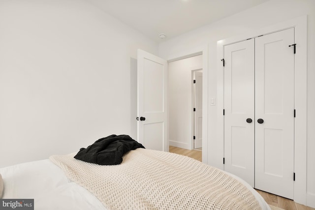 4308 4th St NW, Washington, DC 20011 - bedroom with light wood-style floors, a closet, and baseboards