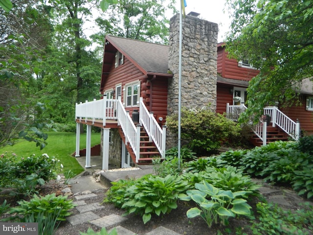 126 Ivy Ln, Lock Haven, PA 17745 - log cabin with stairs, a wooden deck, log exterior, and a front lawn