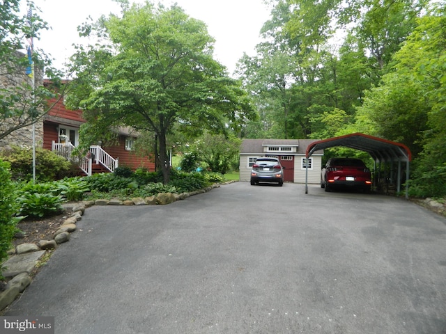 126 Ivy Ln, Lock Haven, PA 17745 - view of parking featuring a carport and asphalt driveway