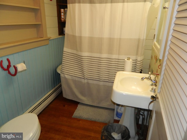 126 Ivy Ln, Lock Haven, PA 17745 - bathroom featuring baseboard heating, wood finished floors, toilet, a shower with shower curtain, and a sink