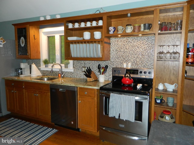 126 Ivy Ln, Lock Haven, PA 17745 - kitchen with appliances with stainless steel finishes, a sink, decorative backsplash, and brown cabinetry