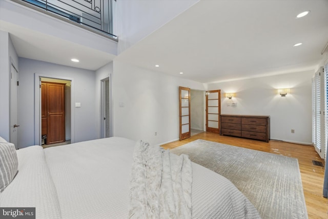137 N 22nd St, Philadelphia, PA 19103 - bedroom with wood finished floors and recessed lighting