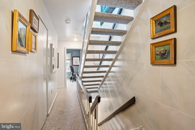 137 N 22nd St, Philadelphia, PA 19103 - staircase featuring carpet flooring