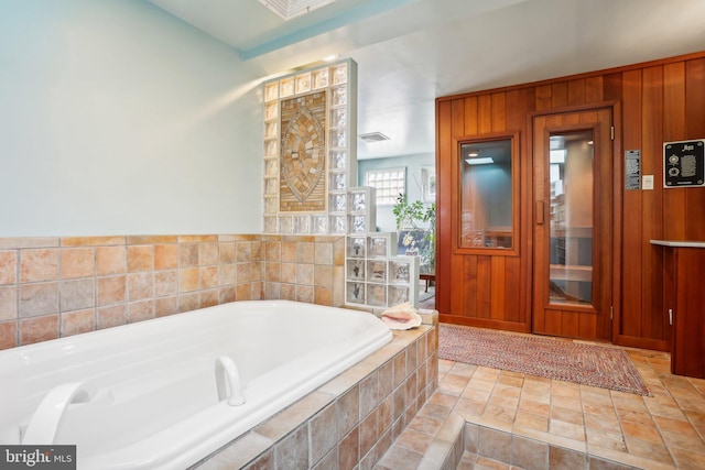 137 N 22nd St, Philadelphia, PA 19103 - full bath with a bath, wooden walls, and stone finish floors