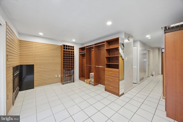 137 N 22nd St, Philadelphia, PA 19103 - unfurnished living room with recessed lighting, a fireplace, and light tile patterned floors