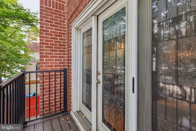 137 N 22nd St, Philadelphia, PA 19103 - doorway to property with a balcony, brick siding, and french doors