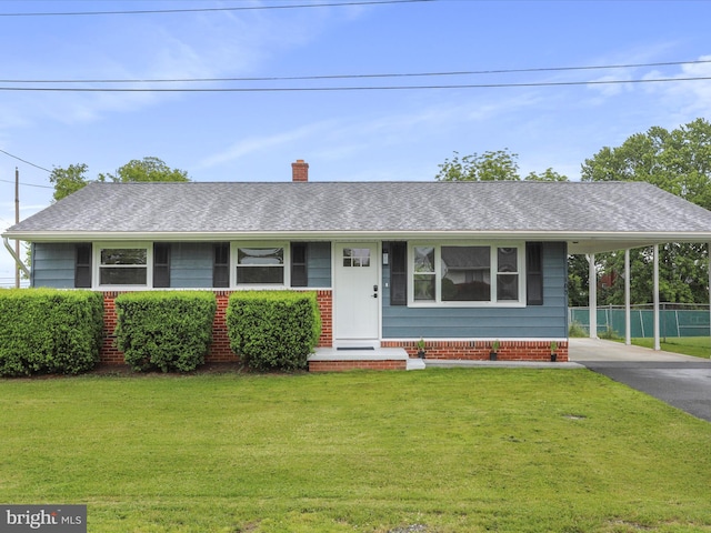 103 Plainfield Dr, Winchester, VA 22602 - view of front of property featuring a front lawn, an attached carport, asphalt driveway, a chimney, and roof with shingles
