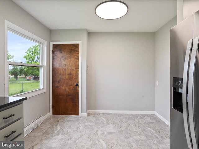 103 Plainfield Dr, Winchester, VA 22602 - interior space featuring stainless steel fridge with ice dispenser, baseboards, and light marble finish floors