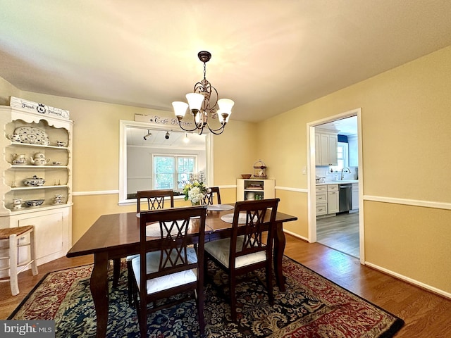 113 Sypherd Dr, Newark, DE 19711 - dining area with a chandelier and dark wood-style floors