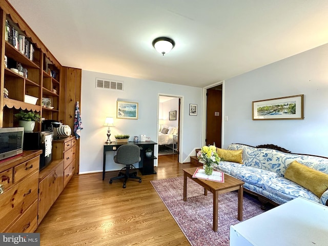 113 Sypherd Dr, Newark, DE 19711 - living room featuring an office area, light wood finished floors, and baseboards