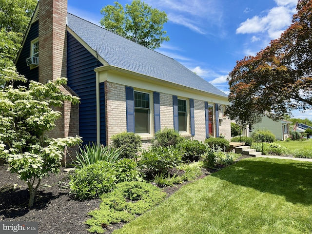 113 Sypherd Dr, Newark, DE 19711 - view of front of home with a chimney, brick siding, a front lawn, and a shingled roof