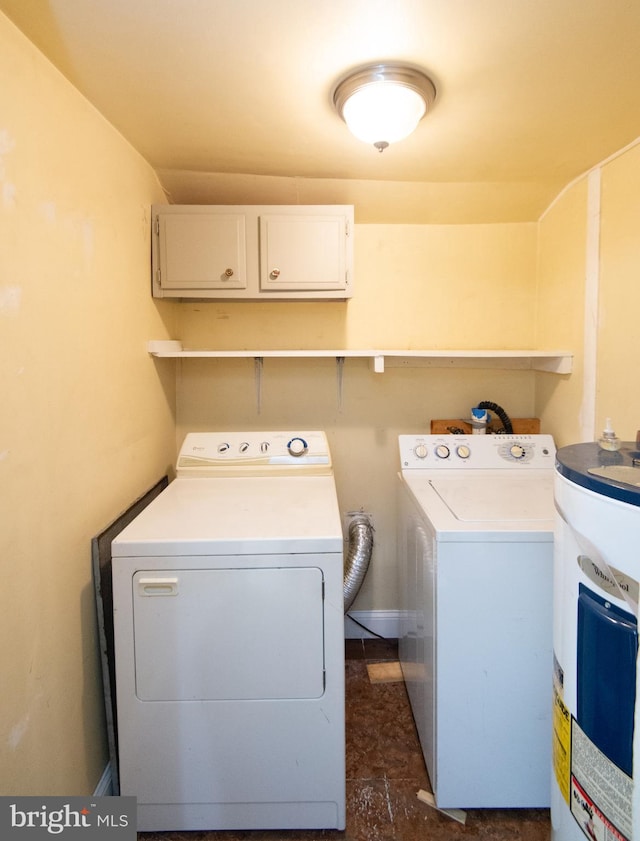 217 W End Ave, Cambridge, MD 21613 - laundry room with washer and dryer, water heater, and cabinet space