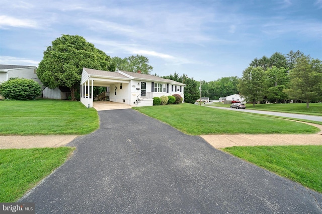 128 Durso Dr, Newark, DE 19711 - ranch-style home with driveway, an attached carport, and a front yard