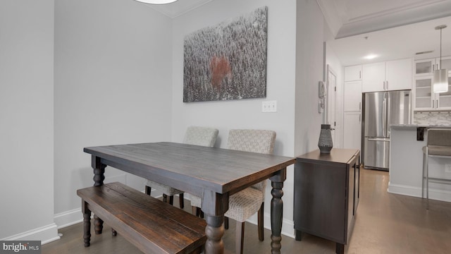 1323 Clifton St NW Unit 34, Washington, DC 20009 - dining space featuring crown molding and dark wood-type flooring