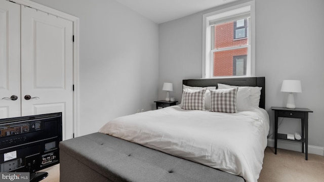 1323 Clifton St NW Unit 34, Washington, DC 20009 - bedroom featuring light carpet and baseboards