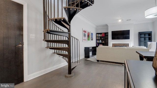 1323 Clifton St NW Unit 34, Washington, DC 20009 - stairway with ornamental molding, wood finished floors, and a fireplace