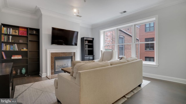 1323 Clifton St NW Unit 34, Washington, DC 20009 - living room featuring dark wood-style flooring, a fireplace, and ornamental molding