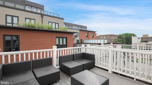 1323 Clifton St NW Unit 34, Washington, DC 20009 - wooden deck featuring outdoor lounge area