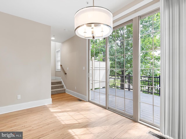 105 Sutton Way, Newark, DE 19711 - doorway with baseboards, wood finished floors, and stairway