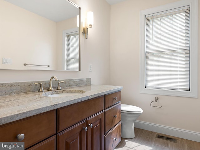 105 Sutton Way, Newark, DE 19711 - bathroom featuring vanity, healthy amount of natural light, toilet, and baseboards