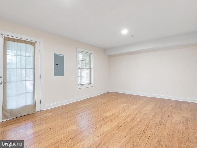 105 Sutton Way, Newark, DE 19711 - empty room with electric panel, light wood-style floors, and baseboards