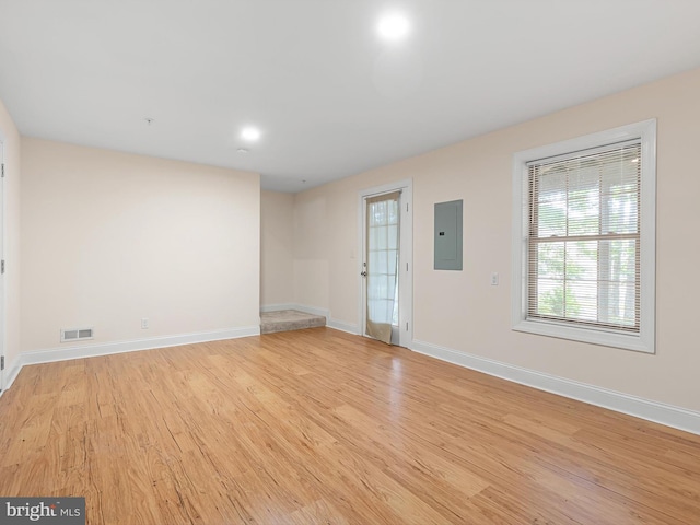 105 Sutton Way, Newark, DE 19711 - empty room featuring electric panel, light wood-style floors, and baseboards