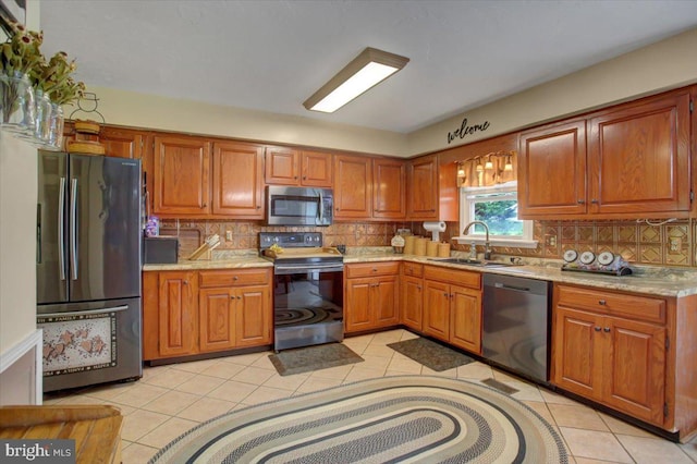 50 Valleyview Dr, Littlestown, PA 17340 - kitchen with stainless steel appliances, a sink, and brown cabinets